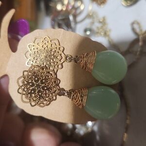 Handmade Gold tone wire wrap with earth stone design earrings.